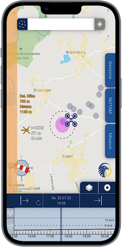 Smartphone with screenshot of app SkyCompanion showing a map with air traffic, drones and warnings and a time slider element with weather data