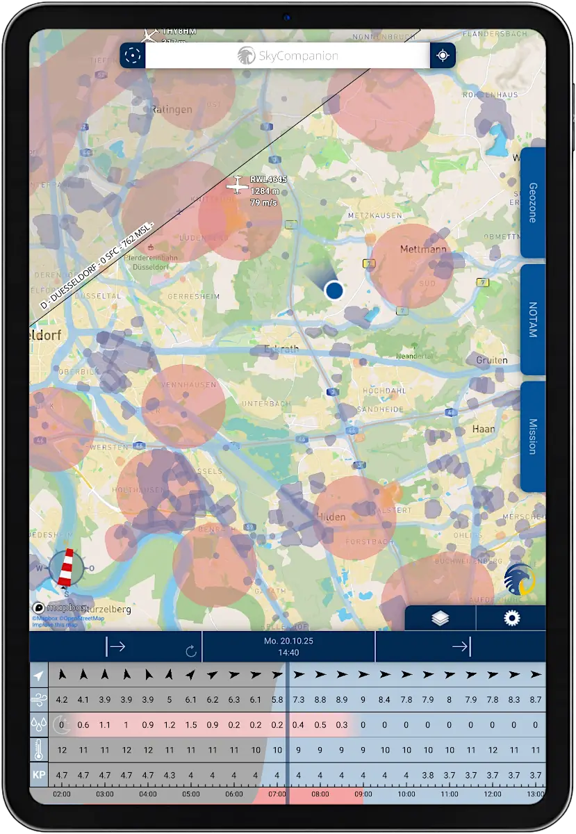 Tablet with screenshot of app SkyCompanion showing a map with geo-zones and a time slider element with weather data.
