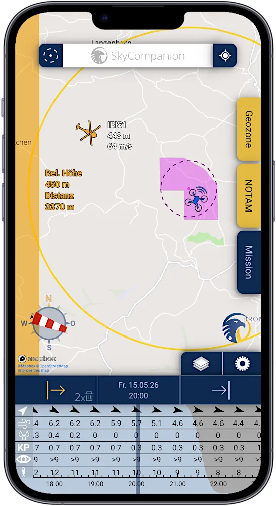 Smartphone with screenshot of app SkyCompanion showing a map with air traffic, drones and warnings and a time slider element with weather data.